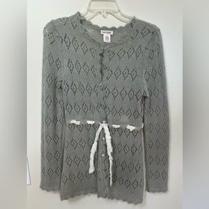 Sweater with tie , grayish color.  A tank top/camisole will be needed under.